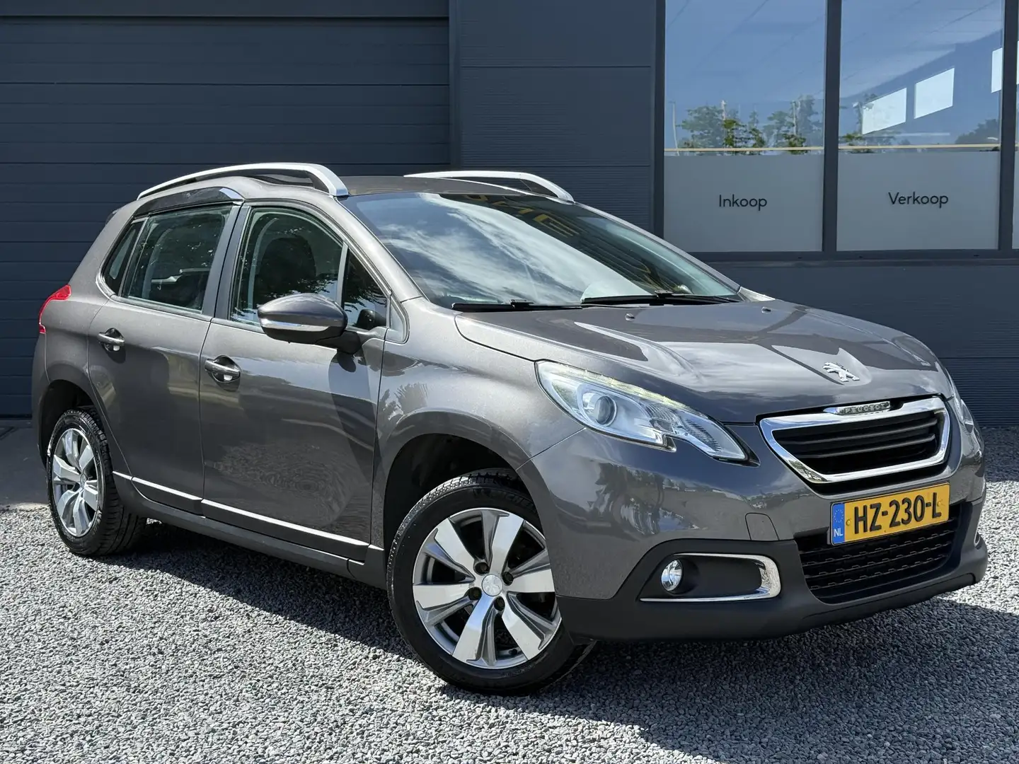 Peugeot 2008 1.2 PureTech Style 2e Eigenaar,Navi,Airco,Cruise,B Gris - 2