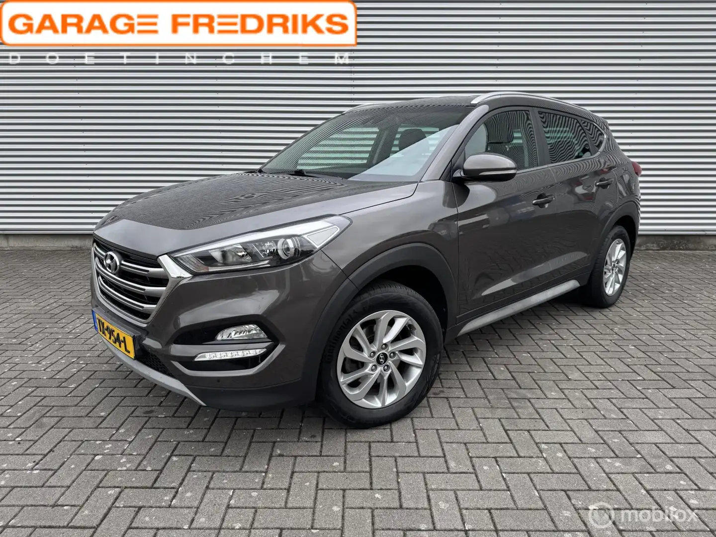 Hyundai TUCSON 1.6 GDi Premium | Navigatie | Stoelverwarming | Bruin - 1