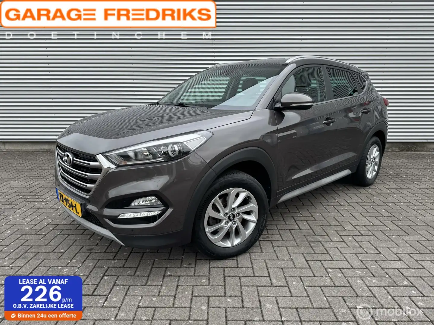 Hyundai TUCSON 1.6 GDi Premium | Navigatie | Stoelverwarming | Maro - 1
