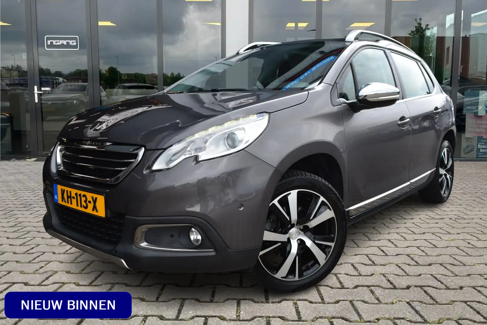 Peugeot 2008 1.2 PureTech Féline | Pano | JBL Audio | Trekhaak Gris - 1