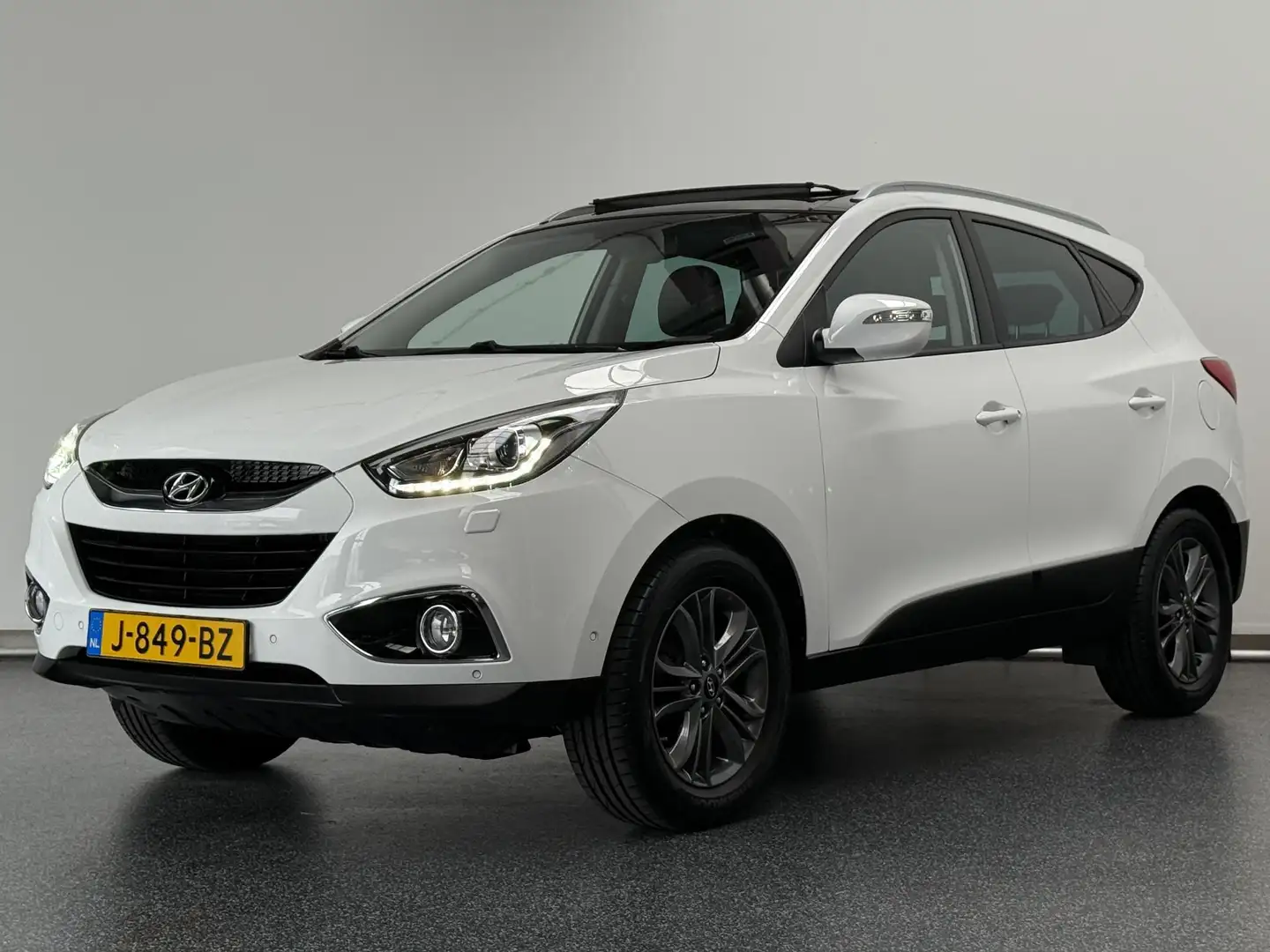 Hyundai iX35 1.6i GDI i-Catcher | Schuifdak | Leer | Camera | N Wit - 1