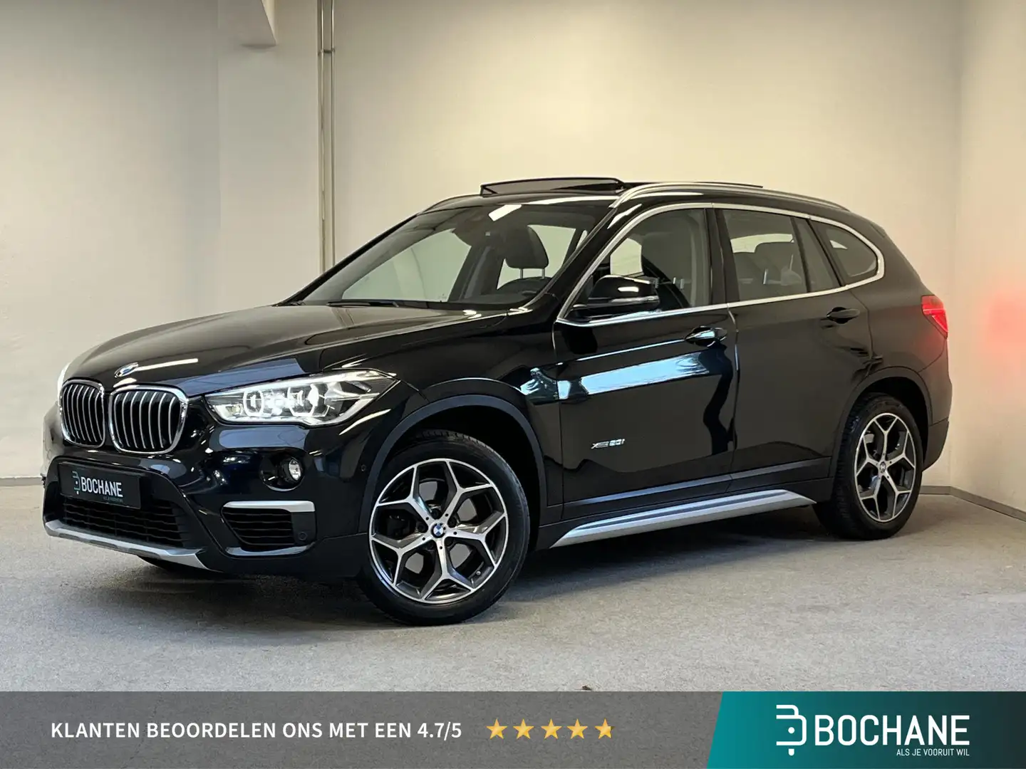 BMW X1 xDrive20i High Executive | LEDER | CAMERA | PANO | Zwart - 1