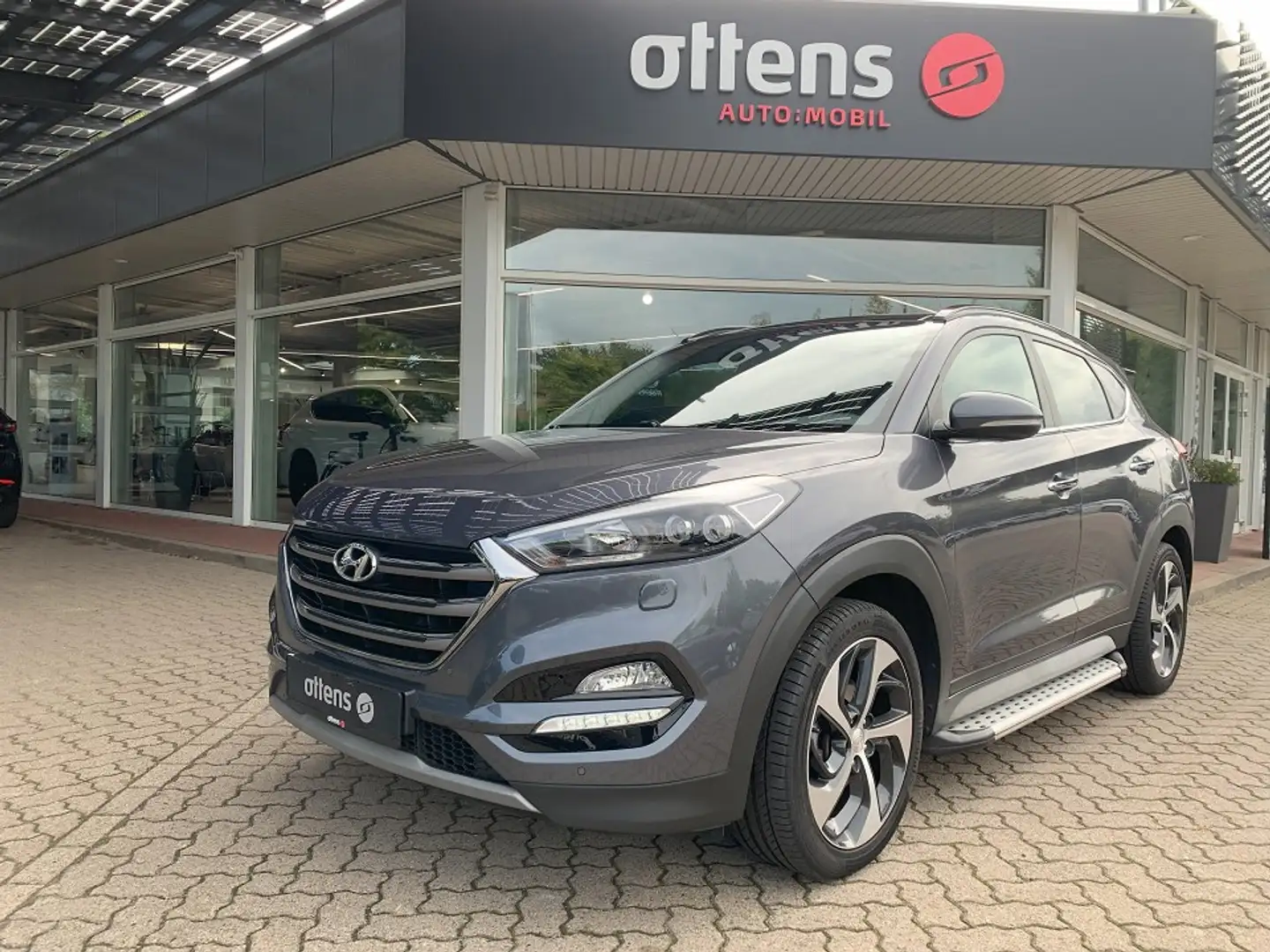 Hyundai TUCSON 1.6T 4WD PREMIUM, Panoramadach, Navi,AHK Premium 4 Gris - 1