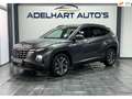 Hyundai TUCSON 1.6 T-GDI MHEV Comfort Smart Automaat / Navigatie Grijs - thumbnail 1