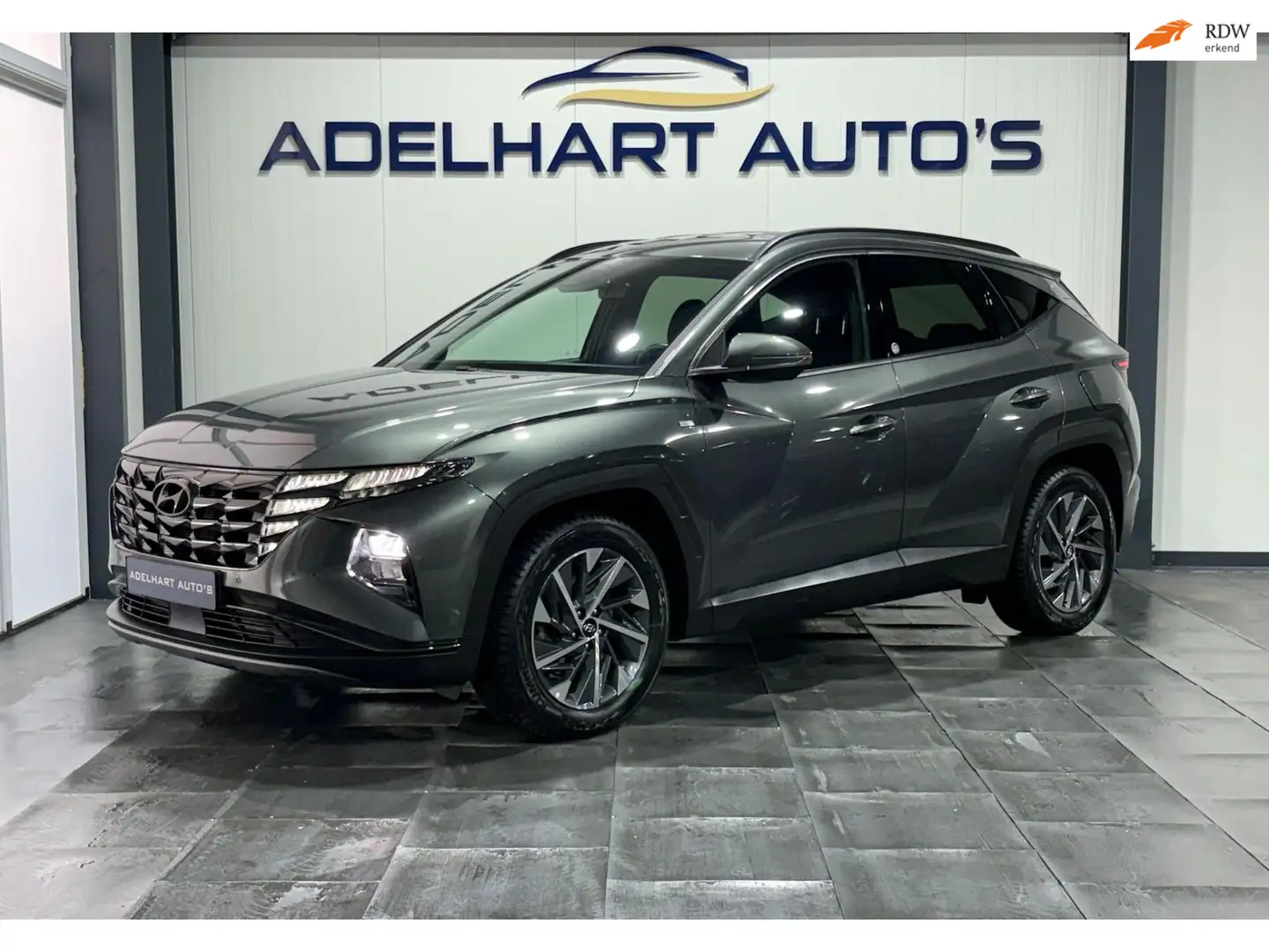 Hyundai TUCSON 1.6 T-GDI MHEV Comfort Smart Automaat / Navigatie Grijs - 1