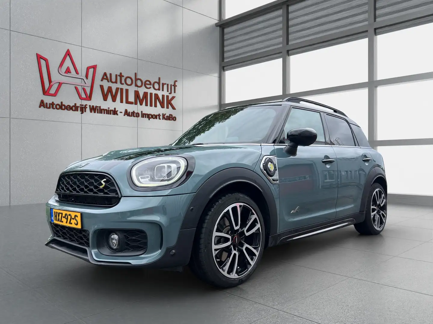 MINI Cooper SE Countryman 2.0 ALL4 JCW Trim Performance Control HK Pano HUD Groen - 1