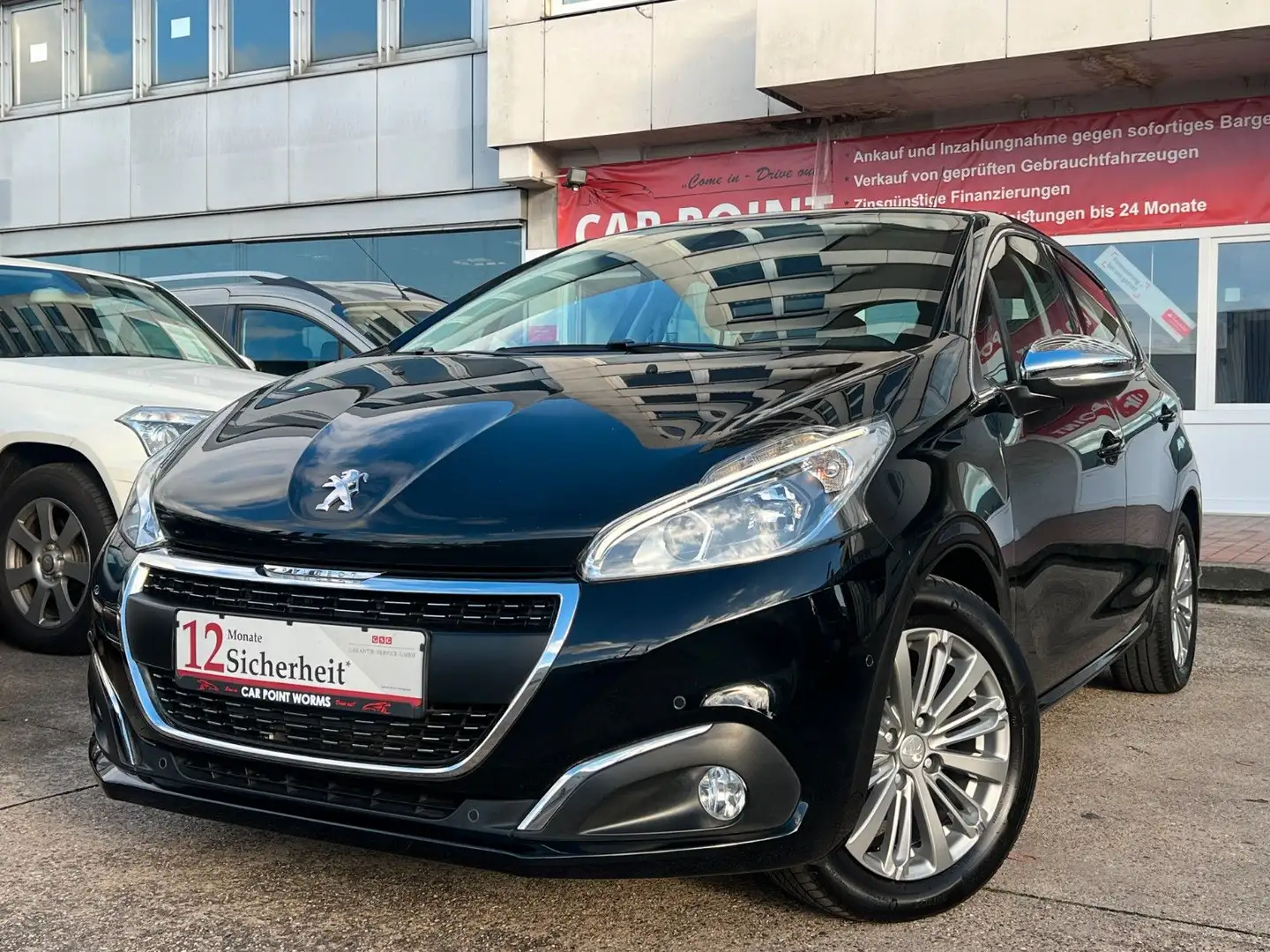 Peugeot 208 Allure *AUTOMATIK*1.HAND*NAVI*CARPLAY*PDC* Schwarz - 1