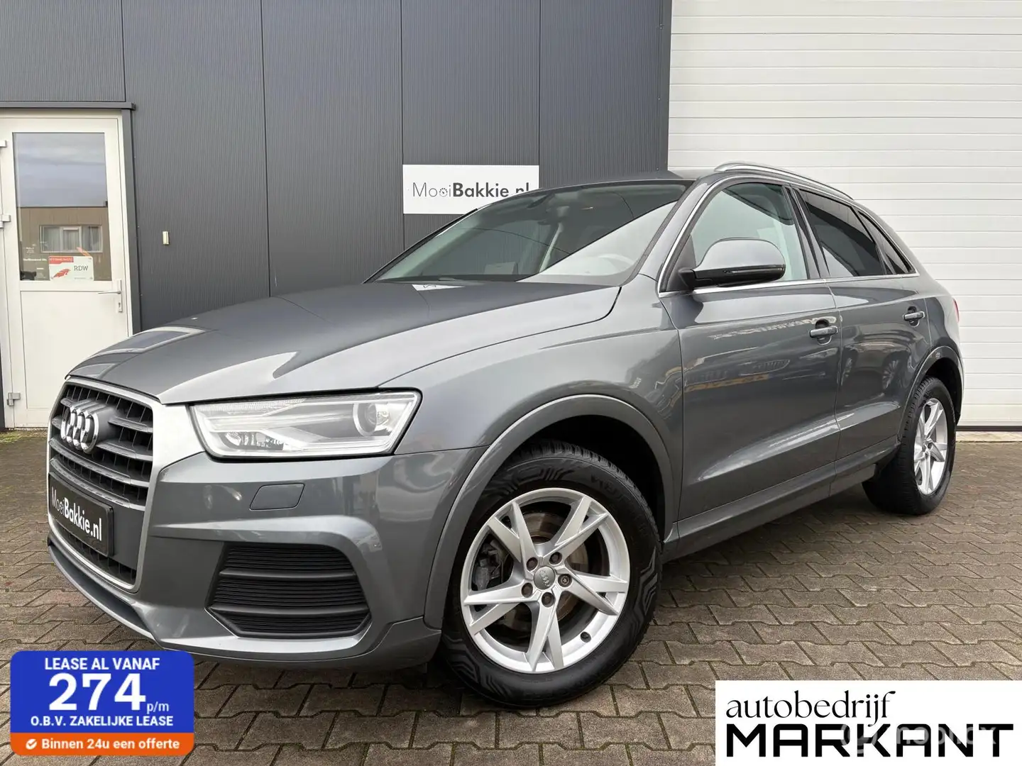 Audi Q3 1.4 TFSI CoD Automaat / Navi / Trekhaak / Xenon / Gris - 1