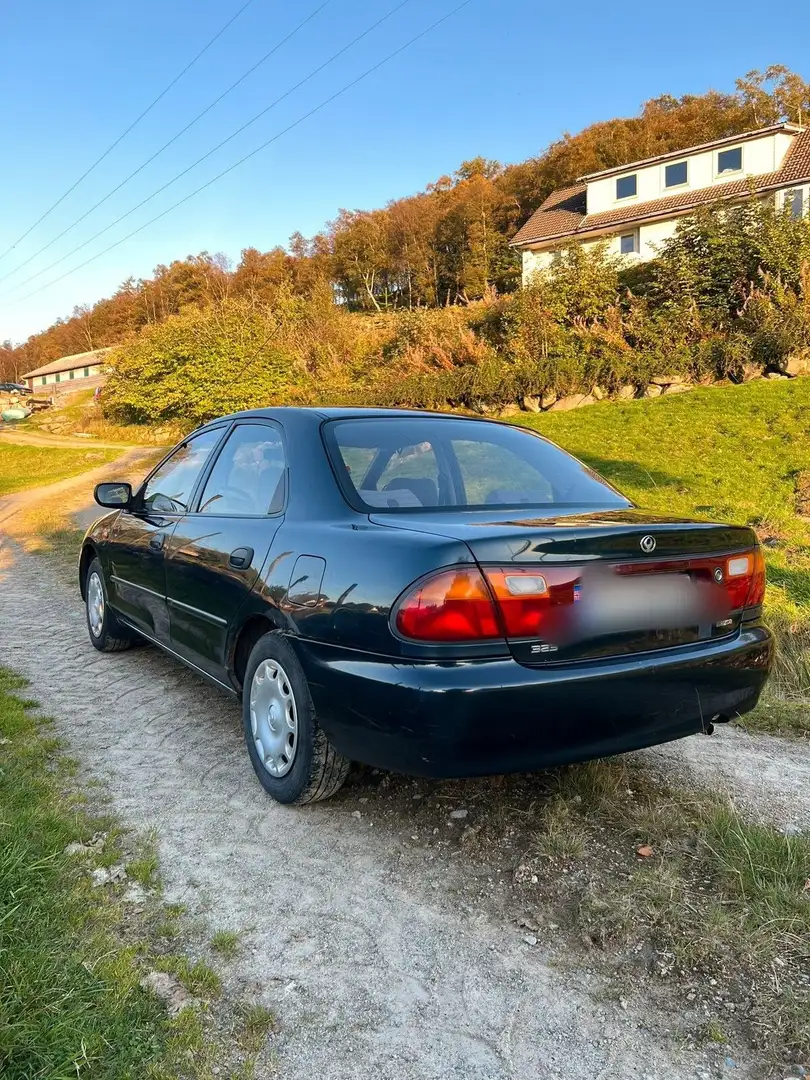 Mazda 323 Blue - 1