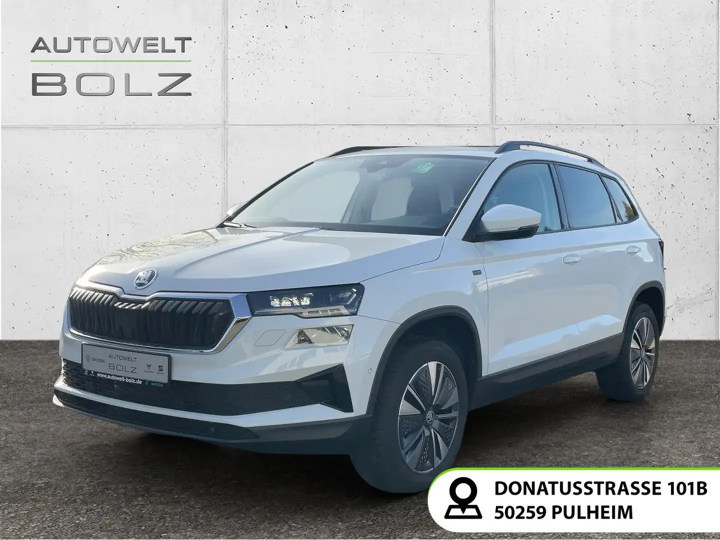 Skoda Karoq Selection 1.5 TSI AHK Pano Navi DigiCock M Weiß - 1