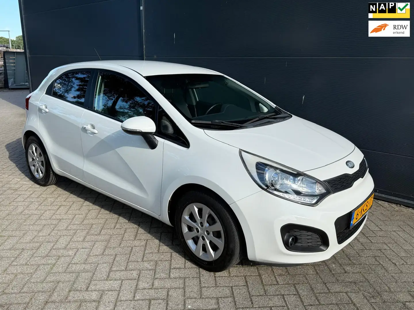 Kia Rio 1.2 CVVT Super Pack/Navi/Airco/cruise/parkeer sens Wit - 1