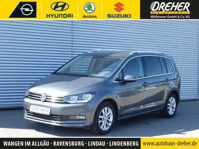 Volkswagen Touran Highline DSG Navi Einparkhilfe Familienvan Autom./Klima/Park Assist./Audiosystem: CD Player/Sitzhzg./MF Lenkrad/BC/eFH.