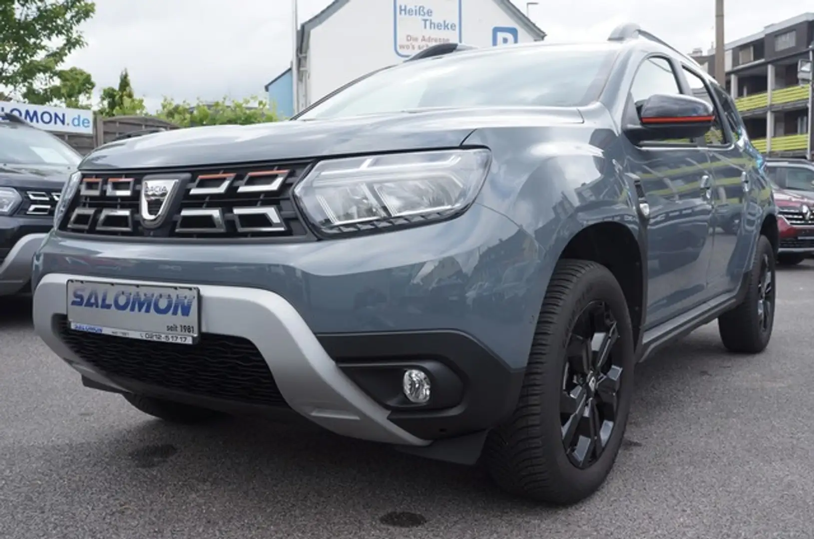 Dacia Duster Extr. Plus 4x4 Allwetter NAVI+4xCam*Klima Gris - 1