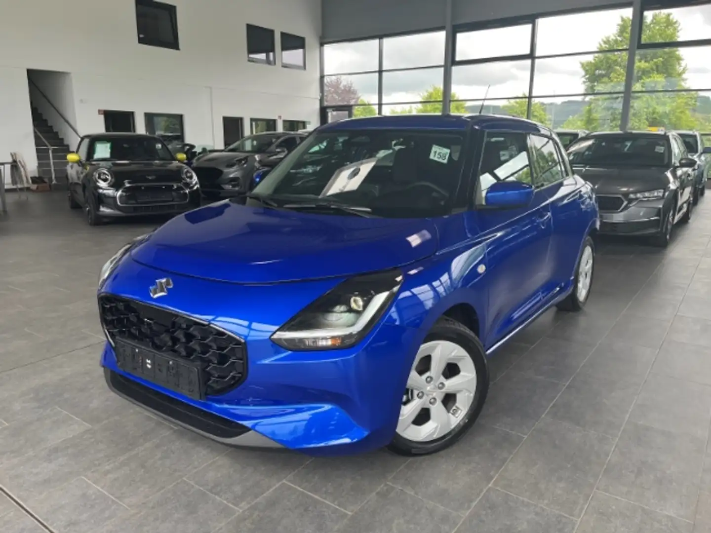 Suzuki Swift 1.2 Comfort LED NAVI ACC Kamera SitzHZG APP Connec Blauw - 1