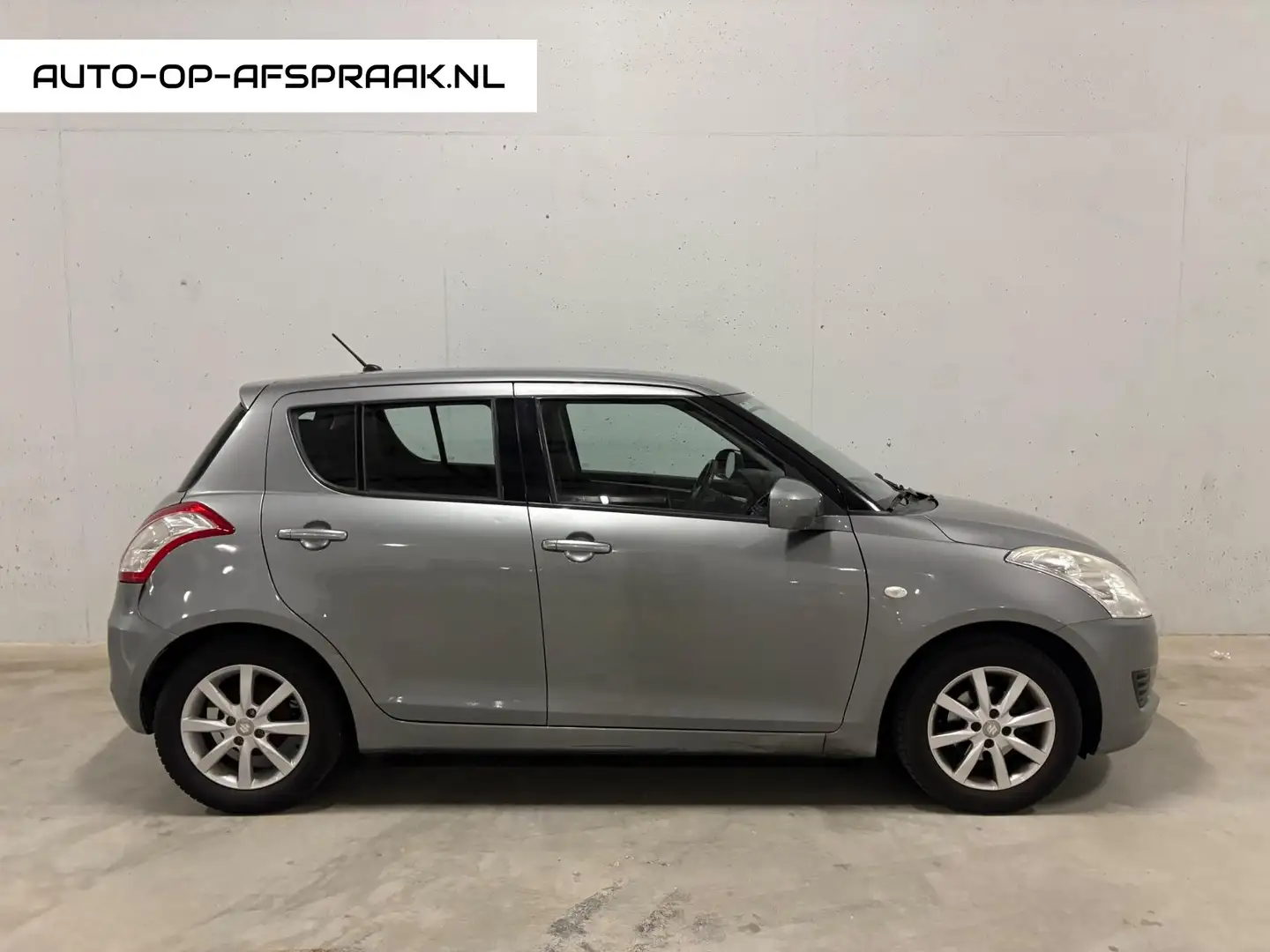 Suzuki Swift 1.2 Comfort EASSS 5drs. Airco Cruise Gris - 1