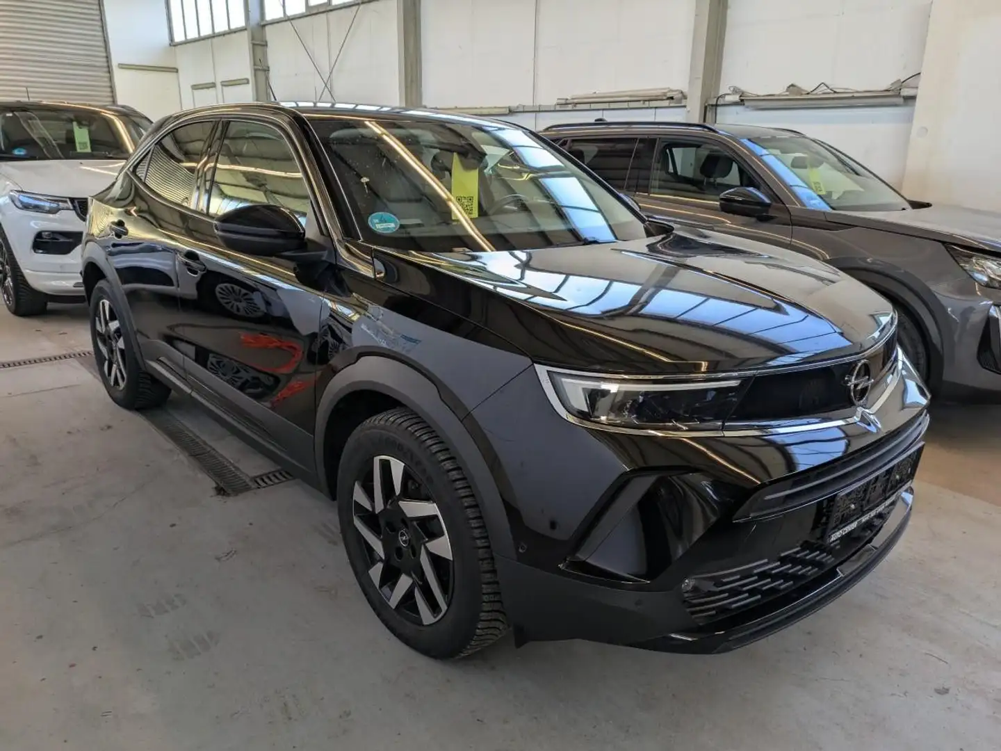 Opel Mokka-E Elegance KAM.+PDC/V/H+NAVI+TEMP+FERN.AS+ Noir - 1