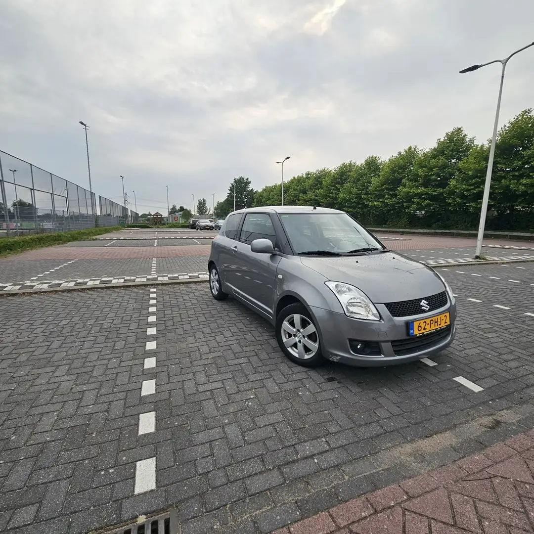 Suzuki Swift 1.3 Limited Grijs - 1