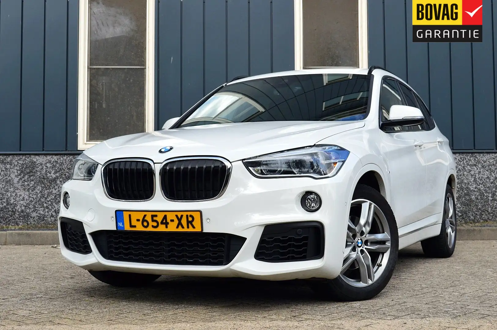 BMW X1 sDrive18i M-Sport Rijklaarprijs-Garantie Navigatie Wit - 1