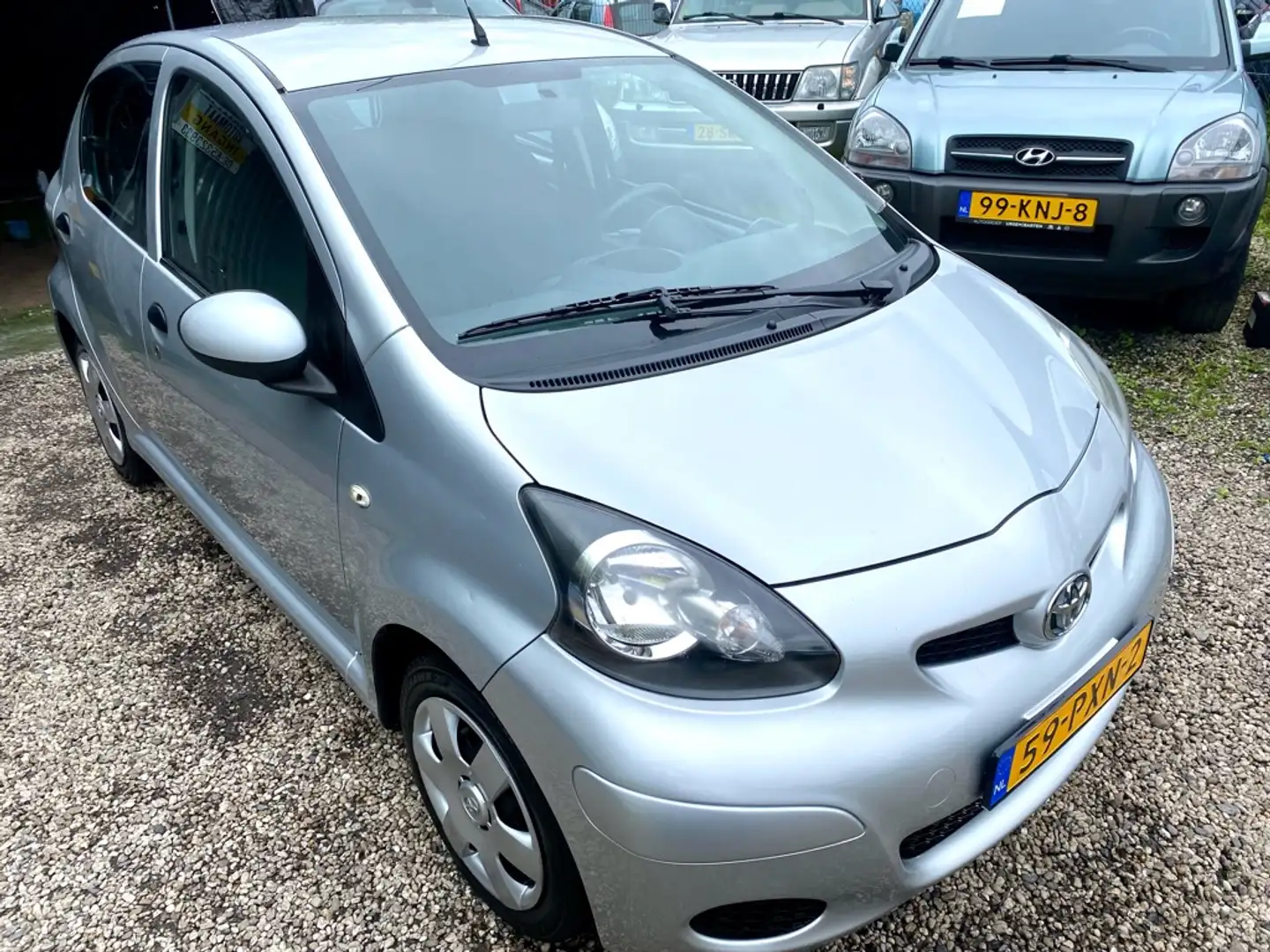 Toyota Aygo 1.0-12V Cool Grijs - 1
