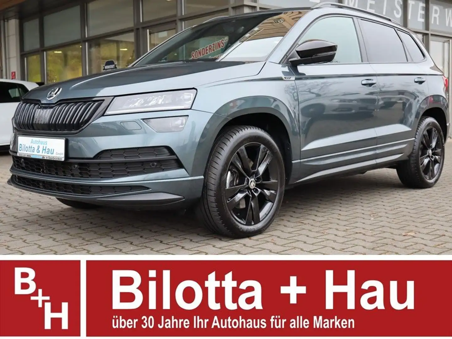 Skoda Karoq 2.0 TSI Sportline 4x4 DSG ! LED+Navi+AHK ! Grau - 1