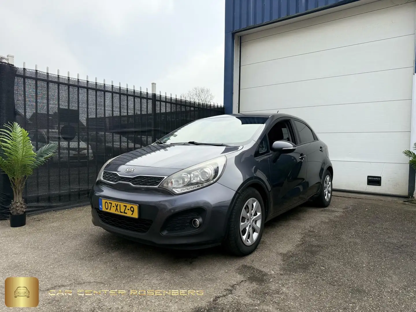 Kia Rio 1.2 CVVT 5D Super Pack|Airco|APK|NAP Grau - 1