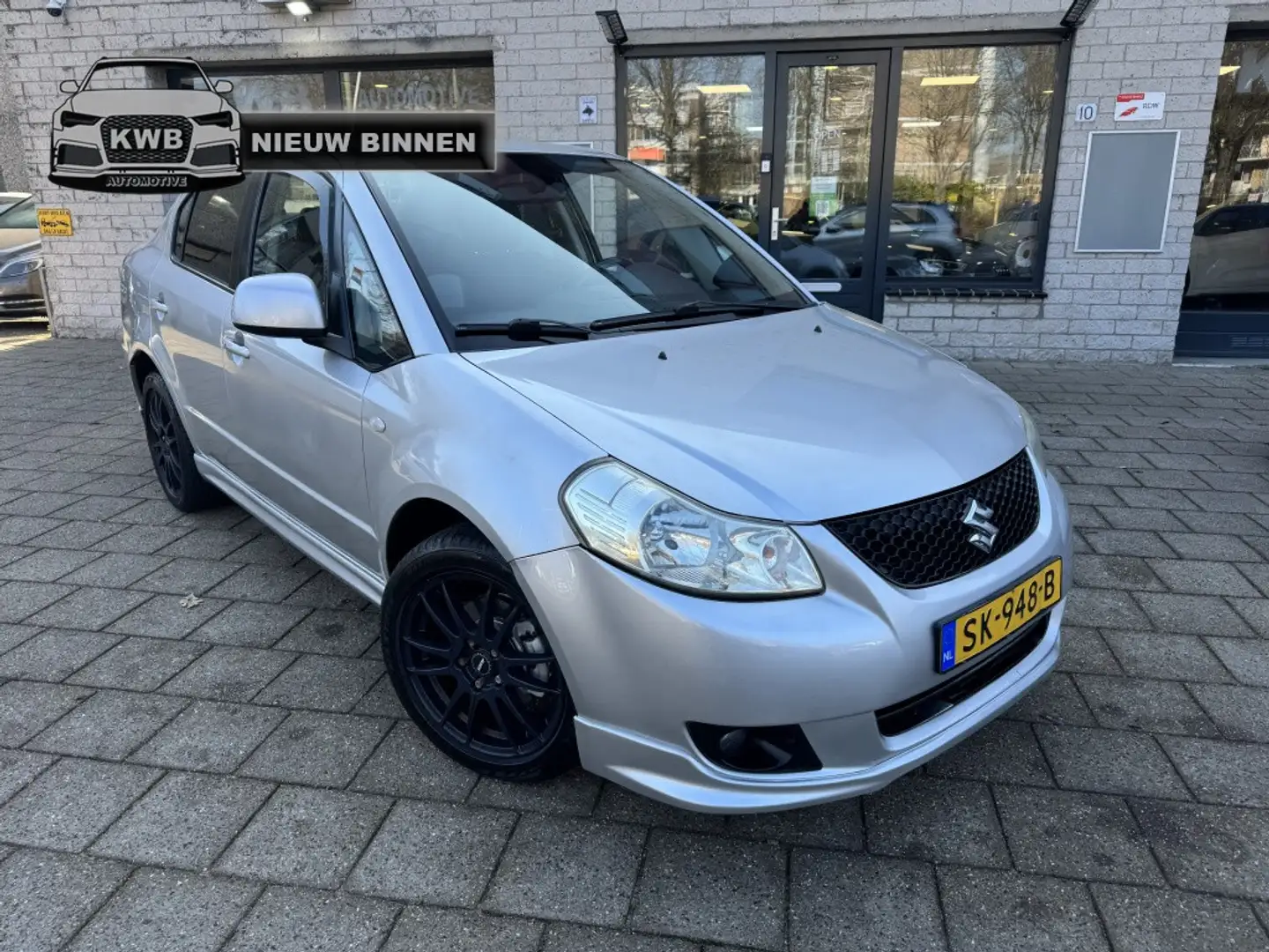 Suzuki SX4 1.6 Sedan Airco Apk Carplay Grau - 1