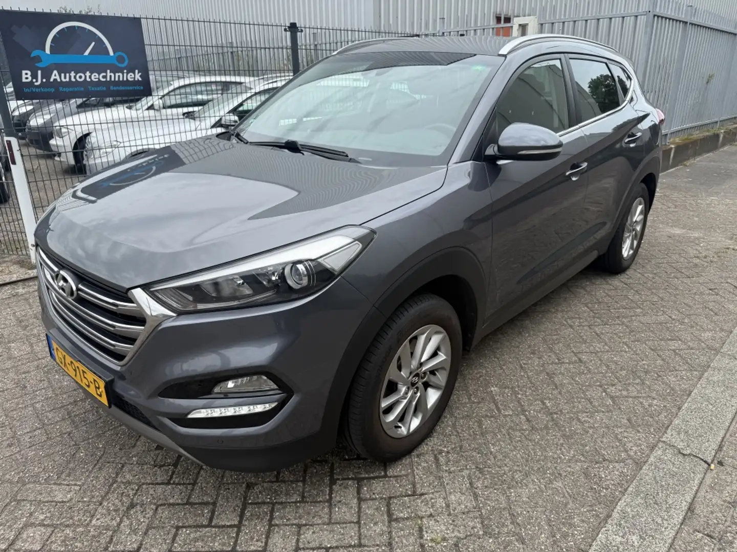Hyundai TUCSON 1.6 GDi Comfort Airco ecc Nw apk !! 1e eigenaar Gris - 1