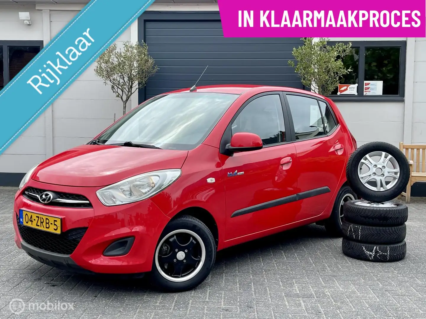 Hyundai i10 1.0 i-Drive|RIJKLAAR|1E EIG|AC|LMV|AUX+USB|GARAN Rojo - 1