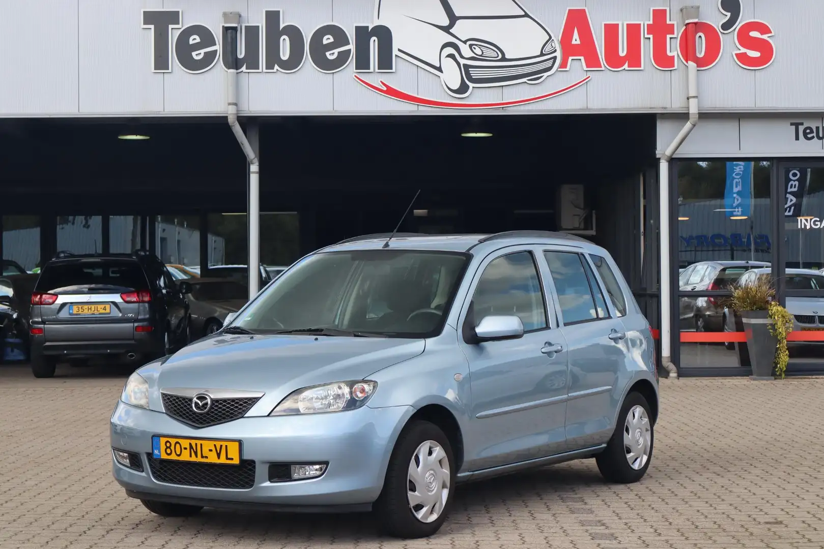 Mazda 2 1.4 Exclusive Airco, Trekhaak, Elektrische ramen Blauw - 1