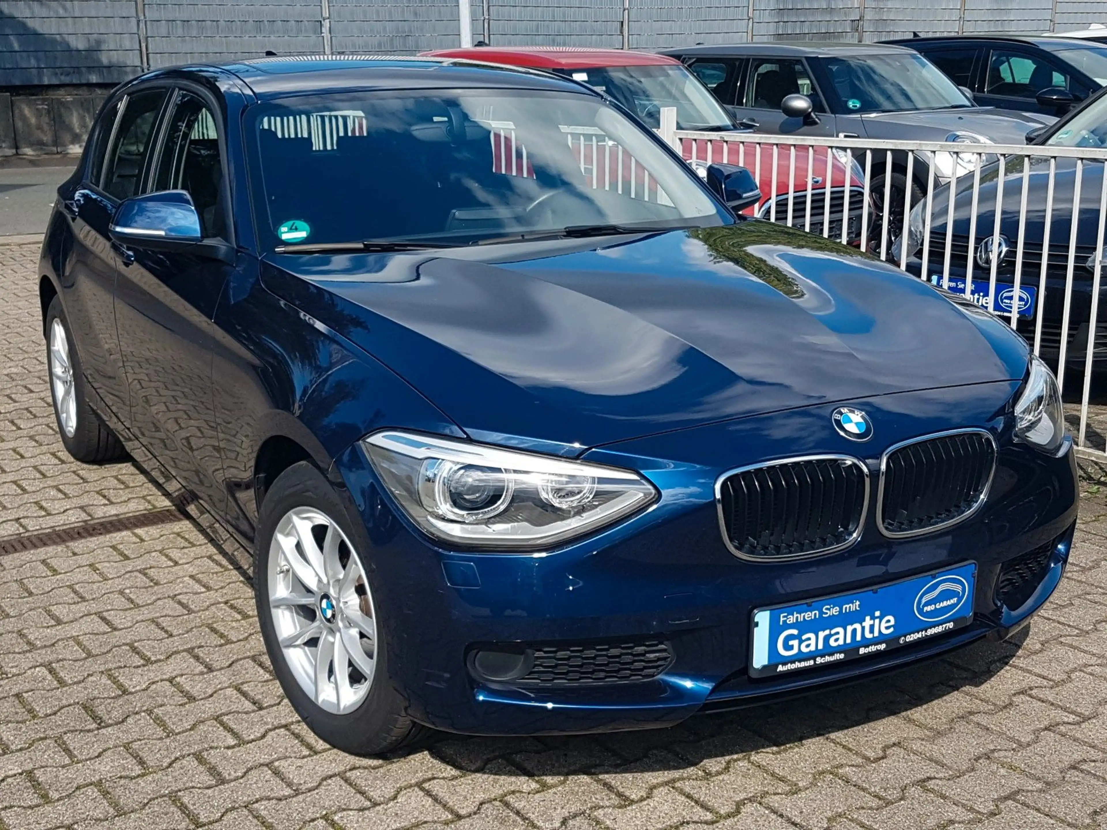 BMW 116 i Automatik 1.Hand eGlasdach Navi Sitzheizg.