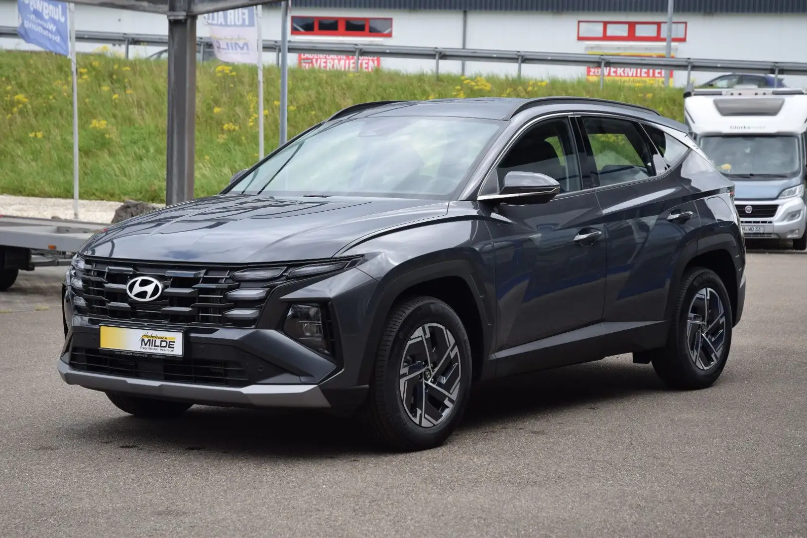 Hyundai TUCSON 1.6 T-GDI NAVI KAMERA SHZ LED AHK VORB. Grau - 1