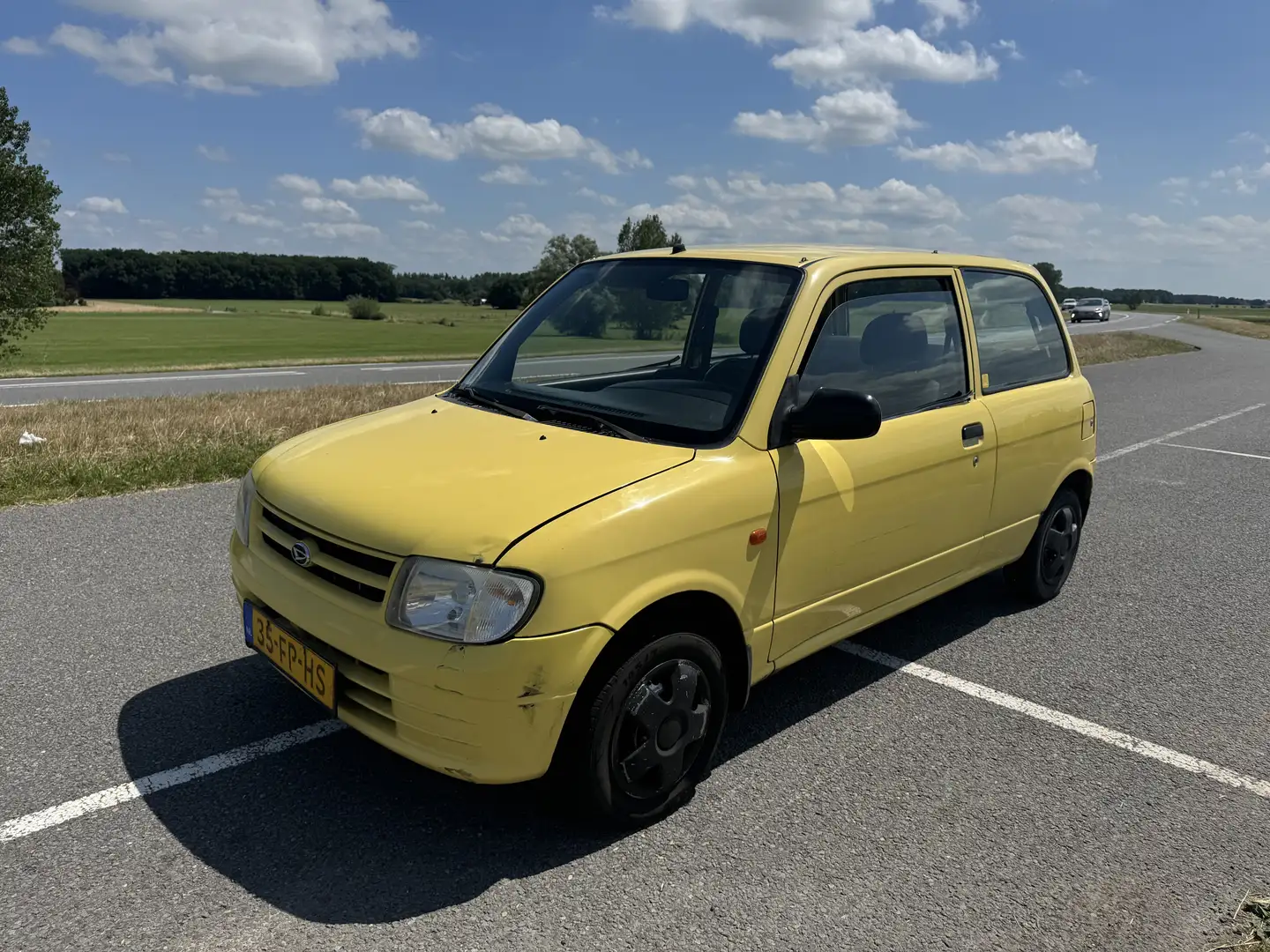 Daihatsu Cuore 1.0-12V STi Żółty - 1