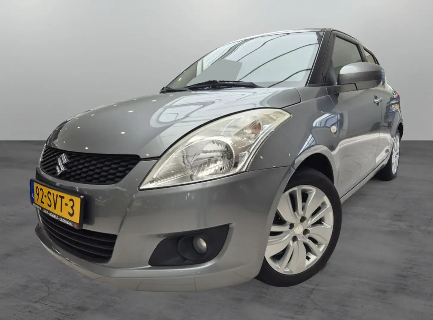 Suzuki Swift 1.2 Exclusive EASSS [ALLSEASON| DEALER OH| CRUISEC Grijs - 1