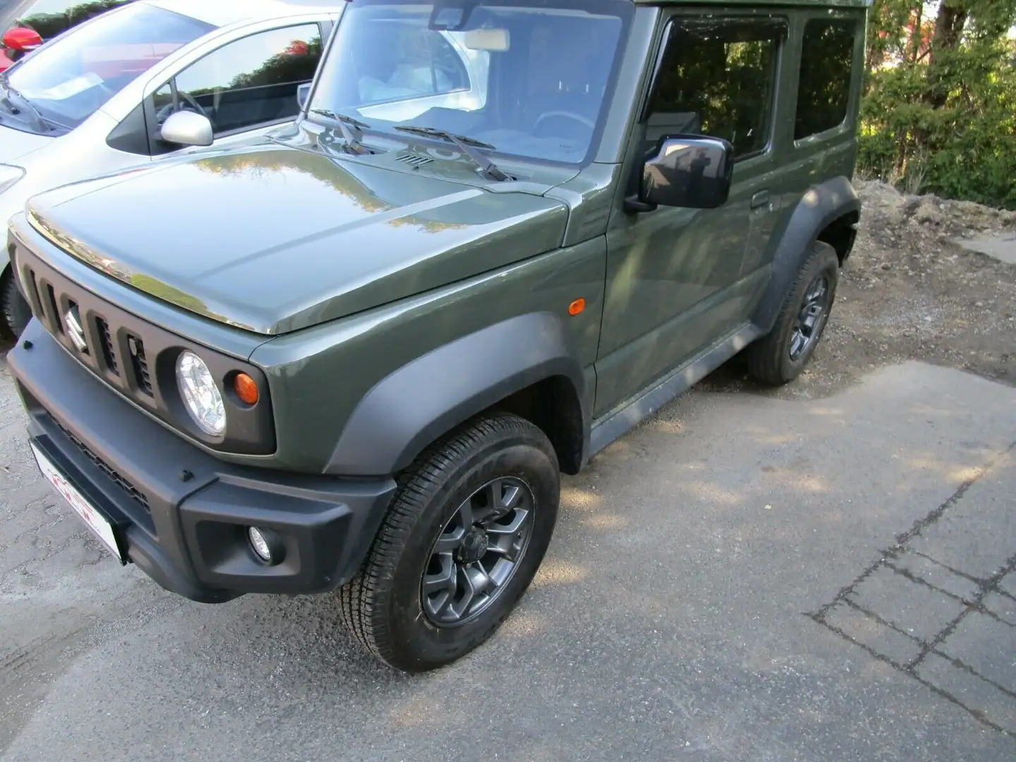 Suzuki Jimny 1.5  Comfort Plus+AZV- sofort Grün - 1