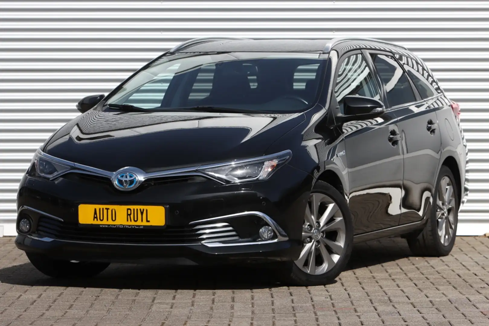 Toyota Auris Touring Sports 1.8 Hybrid Executive Navi / Xenon Zwart - 1