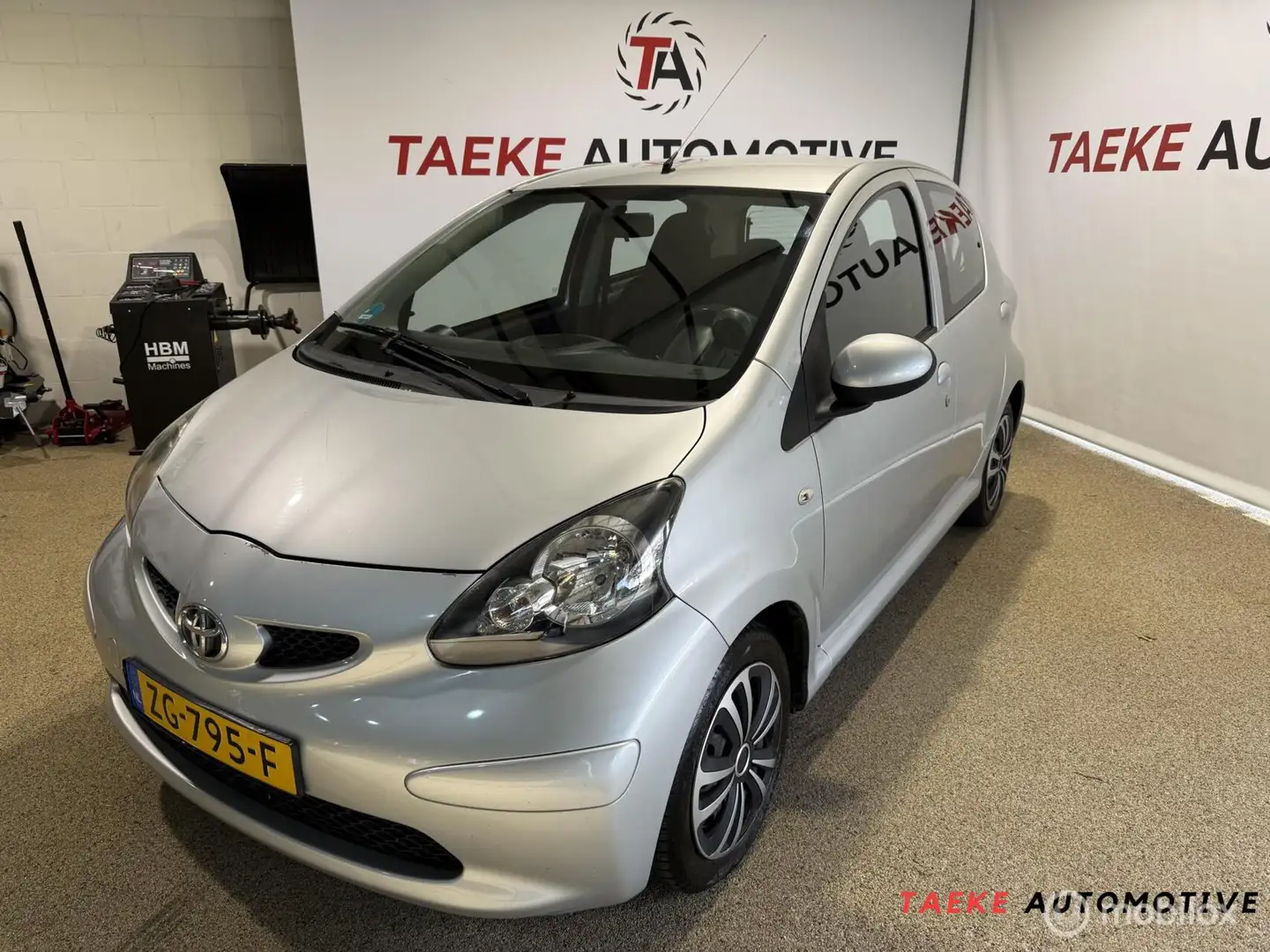 Toyota Aygo 1.0-12V + Airco/Apk Gris - 1