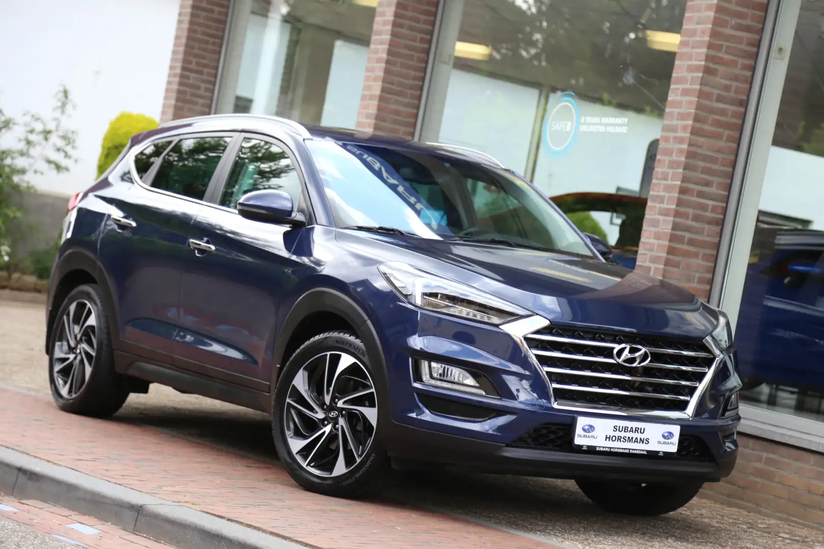 Hyundai TUCSON 1.6 T-GDI 4WD Premium Automaat Leer Camera Navi Blauw - 1