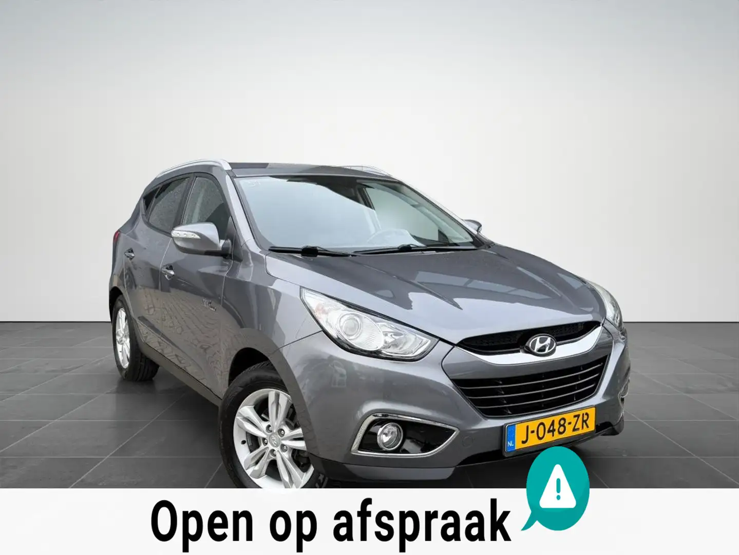 Hyundai iX35 1.6i GDI Clima|Achteruitrijcamera|Trekhaak|NAP Gris - 1