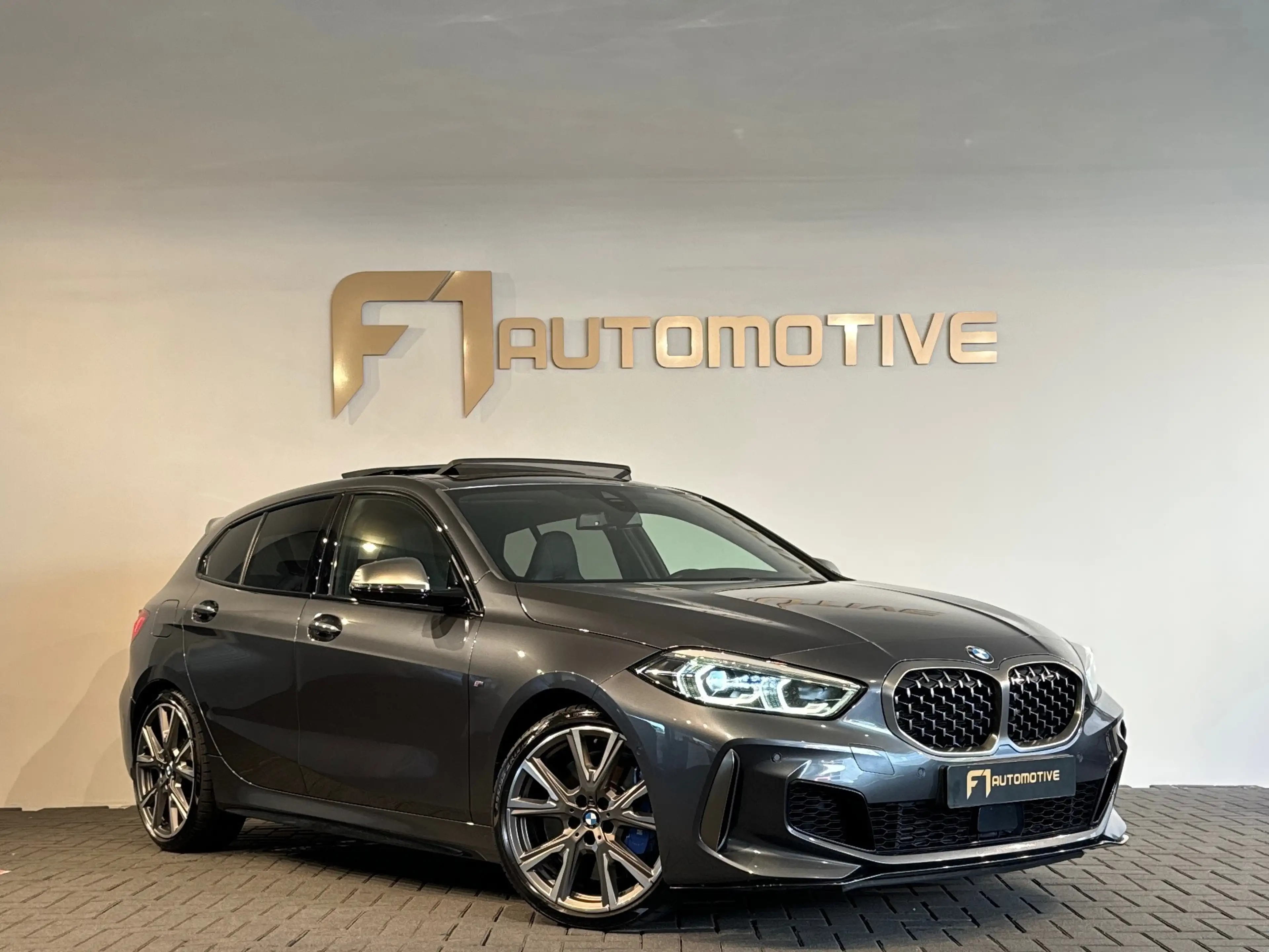 BMW 135 1-serie M135i xDrive High Executive Edition Pano|H — photo 7