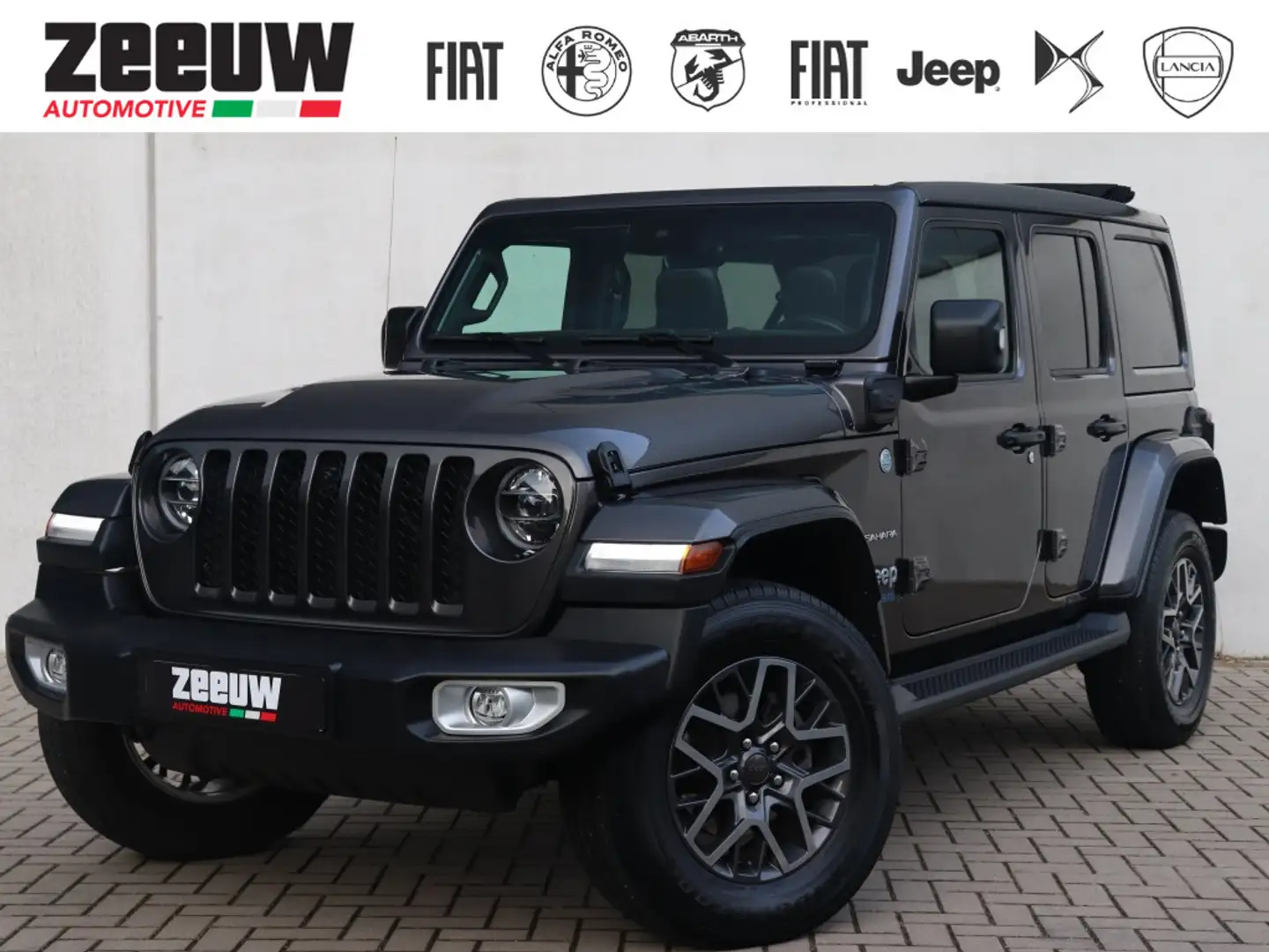 Jeep Wrangler Unlimited 4xe 380 PK Sahara | Leder | Soft Top | C Noir - 1