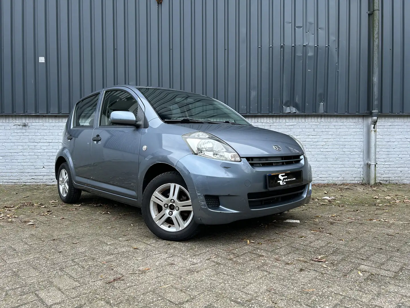 Daihatsu Sirion 1.0-12V Premium Сірий - 1