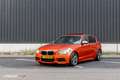 BMW 135 1-serie M135i xDrive High Executive Oranje - thumbnail 9