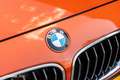 BMW 135 1-serie M135i xDrive High Executive Oranje - thumbnail 3