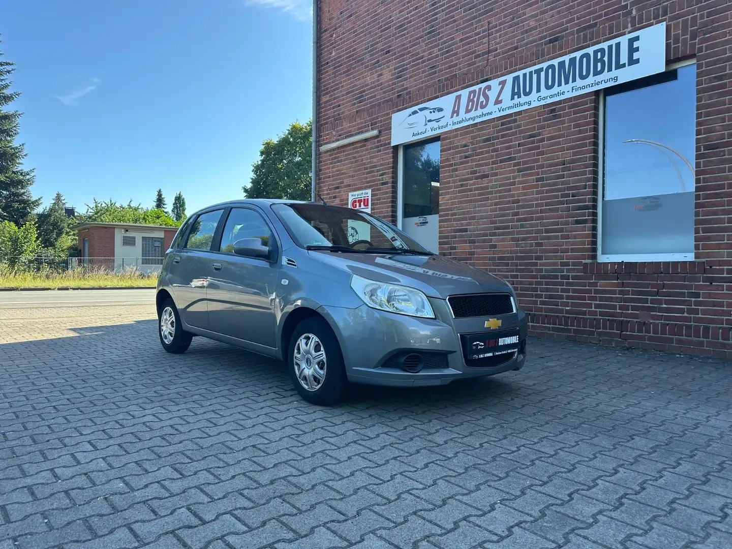 Chevrolet Aveo 1.2 5 Türer/Tüv/Klima/Allwe/ Servo/ 1.Hd/EF Grau - 1