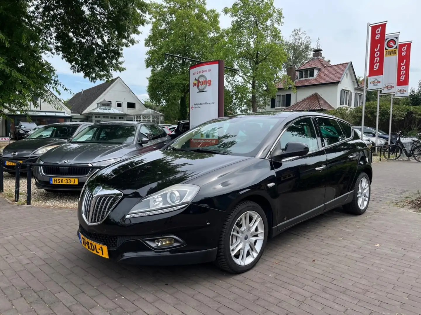 Lancia Delta 1.8-16V DI ORO AUTOMAAT / NAVI / CRUISE CTR. / PDC Zwart - 1