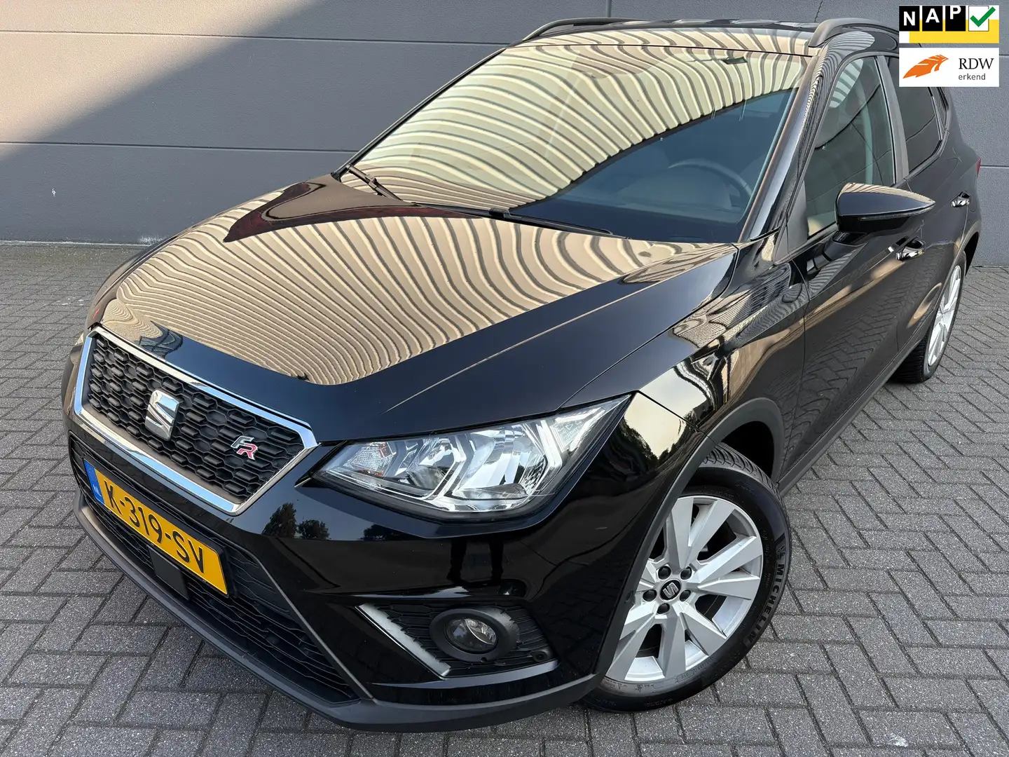 SEAT Arona 1.0 TSI Style FR Business*APK*NAP*AIRCO*CRUISE*NAV Zwart - 1