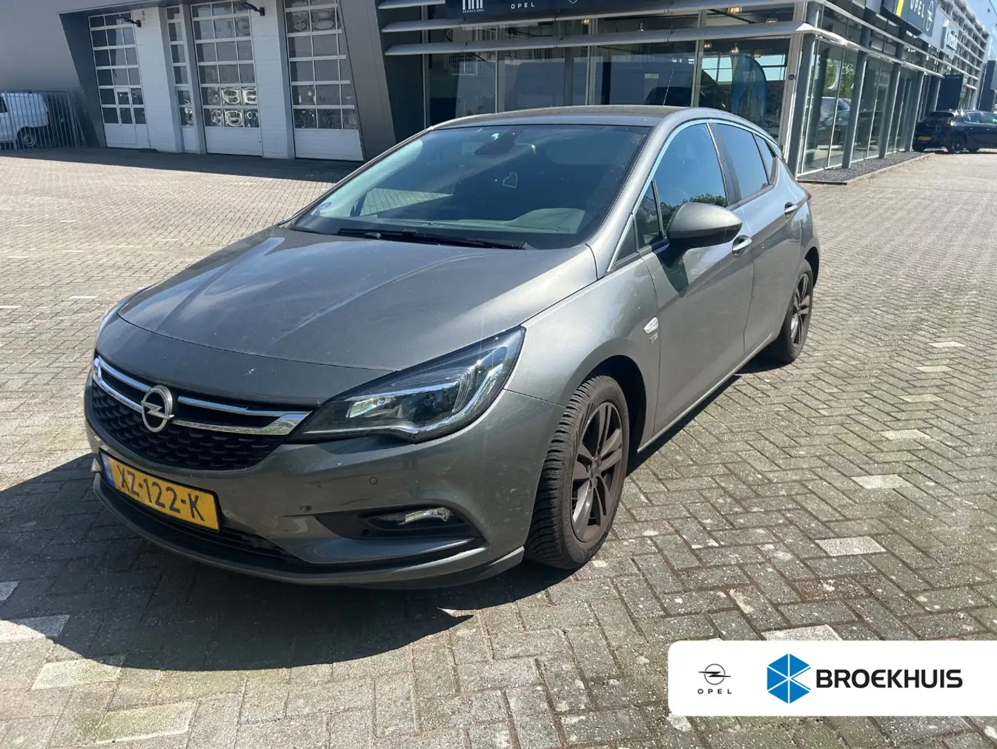 Opel Astra 1.0 Turbo 120 jaar EDITION | 105 PK AIRCO | NAVI | Gris - 1