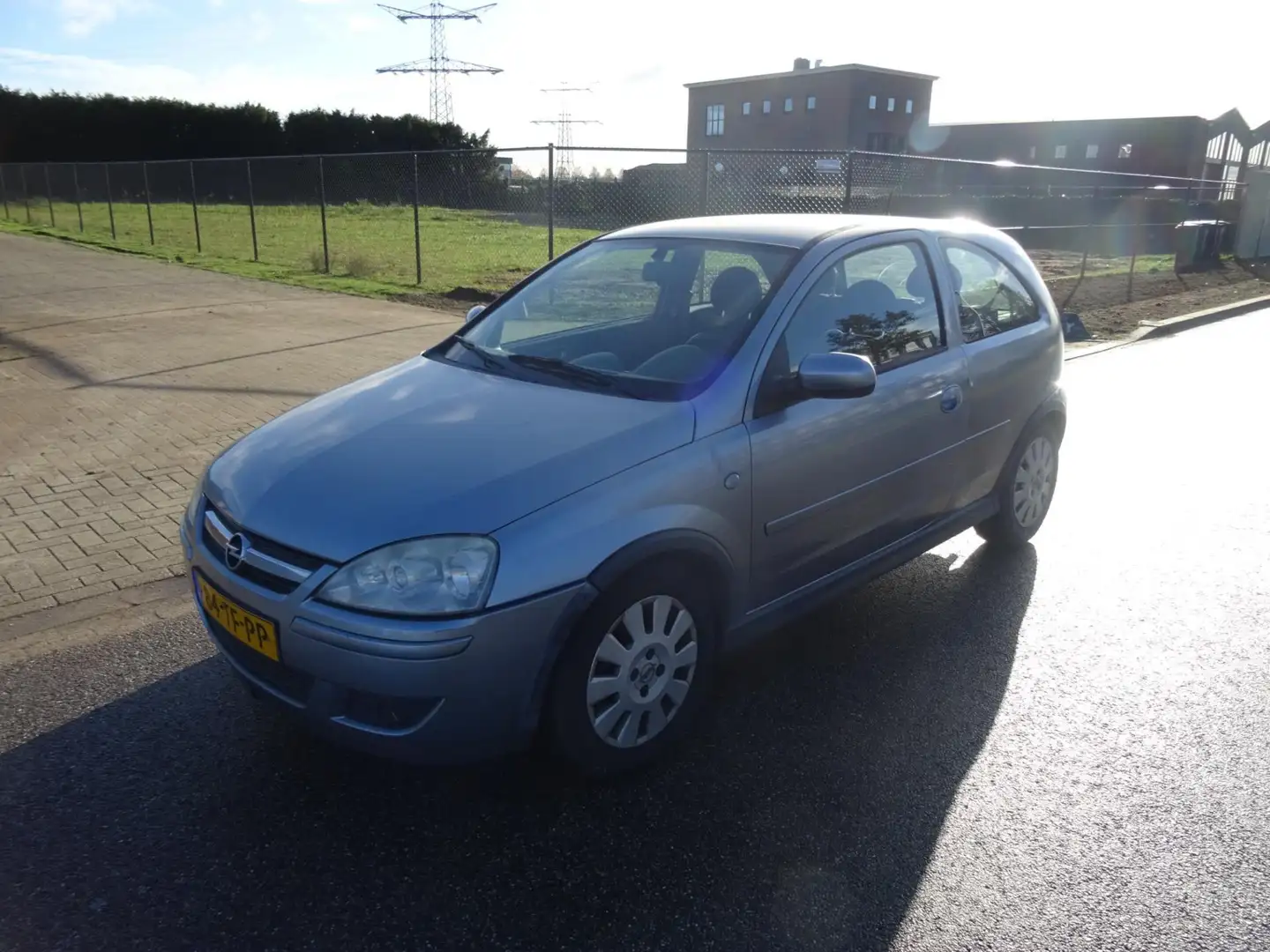 Opel Corsa 1.2-16V Silverline Grijs - 1