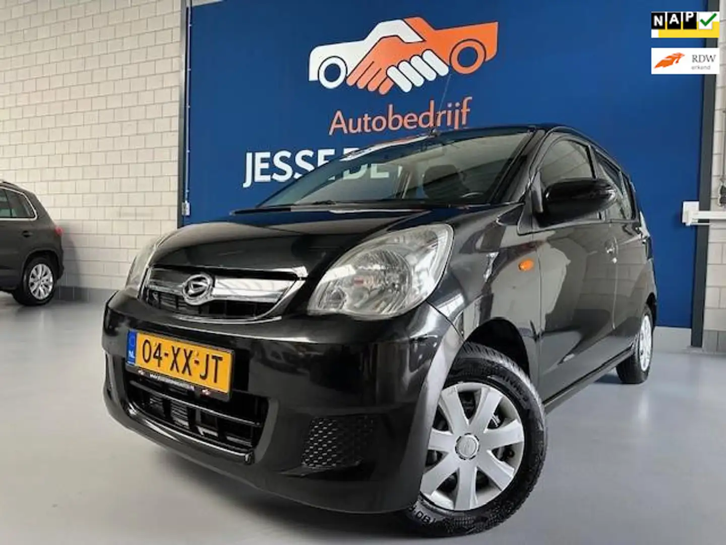 Daihatsu Cuore 1.0 Premium,5 deurs,NAP met 105.734 km. APK tot 01 Negro - 1