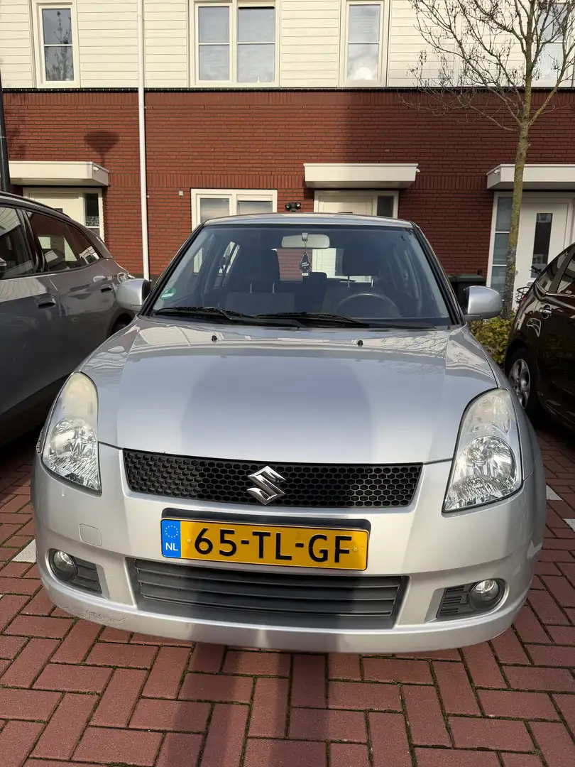 Suzuki Swift 1.3 Shogun Grijs - 1